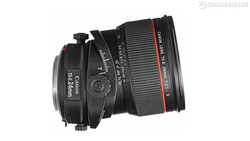 Canon TS-E 24mm tilt-shift lens and Canon 135mm telephoto lens mounted together on white background.