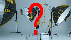 Professional lighting setup with three parabolic reflectors and a large red question mark in the center.