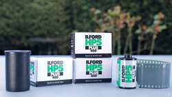 Ilford HP5 Plus 400 black and white film products displayed with canisters and boxes.