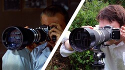 Two photographers holding vintage telephoto lenses with tripod mounts, demonstrating manual focus technique.