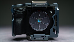 Sony alpha camera rig with custom cage and accessory mounting system viewed from above.