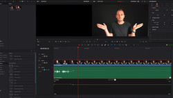Screenshot of video editing software showing a male presenter in the preview window with timeline tracks below containing video and audio clips.