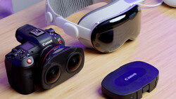 Canon RF mirrorless cinema camera with dual lenses displayed on wooden surface alongside accessories.