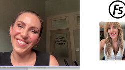 Woman smiling at camera during a video call, wearing black sleeveless top with gold hoop earrings.