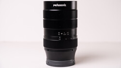Pergear telephoto lens with focus ring and aperture markings displayed against neutral background.