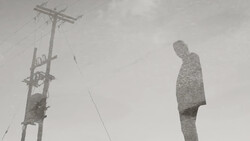 Surreal double-exposure composite showing a figure merged with textured landscape against an overcast sky with utility pole.