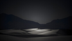Minimalist landscape with illuminated ground plane and dark mountainous silhouettes against twilight sky.