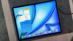 Screenshot of tablet displaying macOS-style desktop with widgets, calendar, and dock interface.
