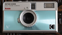 Kodak Ektar H35N half-frame camera with light blue body and chrome lens.