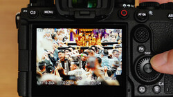 Camera rear LCD screen displaying a multi-angle video recording interface with timestamp and metadata overlays.