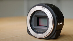 Sony mirrorless camera body with open mount showing sensor and mirror mechanism.