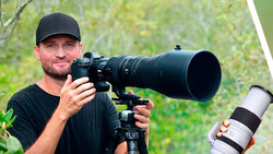 Photographer holding telephoto lens on camera mounted to tripod, with second telephoto lens displayed separately.