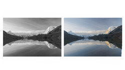 Mountain landscape reflected in still alpine lake, shown in black-and-white and color side-by-side comparison.