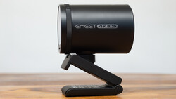 EMEET 4K UHD webcam mounted on a black stand against a wooden surface.