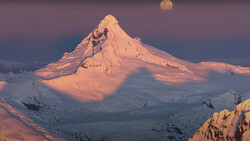 Snow-covered conical volcano peak illuminated by golden sunrise light, with the moon visible above and surrounding snowy terrain below.