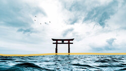 Japanese torii gate silhouetted against sky, standing alone in ocean water with birds flying overhead.