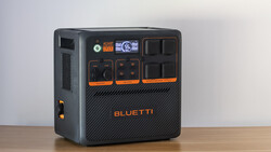 Bluetti portable power station with black casing and orange accents, featuring multiple AC outlets and control panels.
