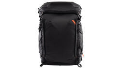 Black camera backpack with orange accent details and multiple compartments against white background.