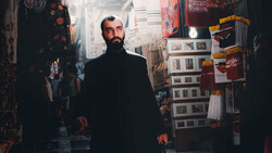 Bearded man in dark coat walking through narrow marketplace corridor lined with merchandise displays.