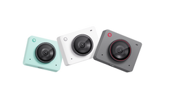 Three compact digital cameras in mint, white, and dark gray with red accents, arranged in a row.