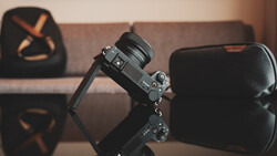 Sony mirrorless camera mounted on a gimbal stabilizer in an indoor studio setting.