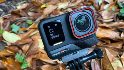 Insta360 Ace Pro 2 action camera mounted on tripod against forest floor background.