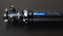 Leofoto Ranger LS-284CEX carbon fiber tripod with ball head and quick-release plate against dark background.