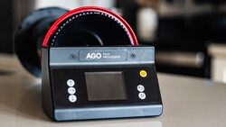 AGO Film Processor with red dial and digital control panel on gray surface.