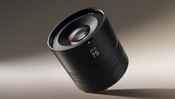 Zeiss Milvus 1.4/25 prime lens tilted against neutral background with dramatic side lighting.