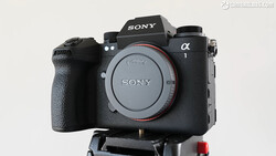 Sony a1 mirrorless camera body mounted on a tripod plate, shown from the front against a neutral background.