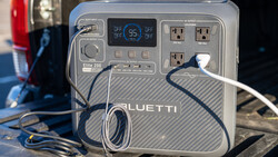 Bluetti Elite 200 portable power station with AC outlets and USB ports, displaying 95% battery charge on screen.