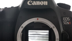 Canon EOS 5DS DSLR camera body with mirror open, showing the sensor and internal mirror mechanism.