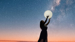 Silhouetted figure reaching toward a glowing full moon against a starry night sky with the Milky Way visible.