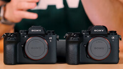 Two Sony Alpha 1 mirrorless cameras displayed side by side, showing their black bodies and grip texturing.