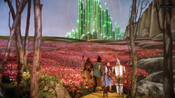 Illustration of characters on a yellow brick road overlooking an emerald city across a red poppy field.
