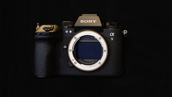Sony α9 mirrorless camera body front view with lens mount visible against black background.