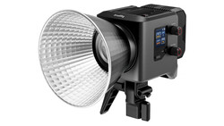 Professional LED studio light with large reflector dish and mounted control panel.