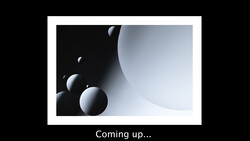 3D render of white spheres in graduated sizes arranged against dark and light curved surfaces.