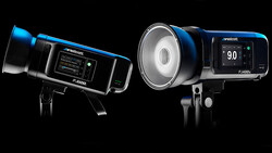Two Westcott professional studio flash units with blue accents and digital control panels, photographed against black background.