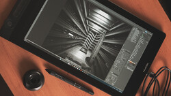 Screenshot of 3D rendering software displaying a geometric spiral staircase visualization on a tablet.