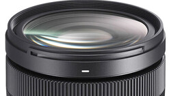 Close-up of a wide-angle camera lens showing glass elements and internal optics.