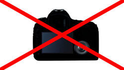 Illustration of a DSLR camera with a red X overlaid across it.