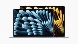 Two laptop displays showing dynamic radial stripe patterns in blue and gold tones.