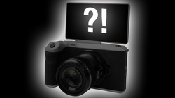 Illustration of a digital camera with a flip-up screen displaying question and exclamation marks.