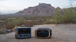 Two portable power station units positioned on desert ground with mountains and desert vegetation in background.