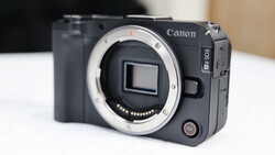 Canon EOS R5C mirrorless camera body with lens mount exposed, displayed against neutral background.