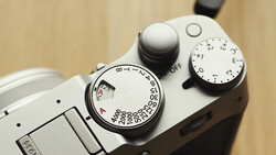 Close-up of a vintage rangefinder camera's top plate showing aperture and shutter speed dials.
