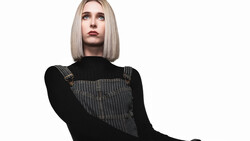 Woman with platinum blonde bob wearing black long-sleeve shirt and gray pinstriped vest over white background.