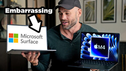 Man holding Microsoft Surface laptop in one hand and Apple M4 MacBook in the other, with text labeling the Surface as embarrassing.