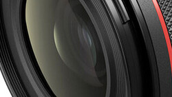 Close-up view of camera lens elements and internal glass components with layered optical surfaces.